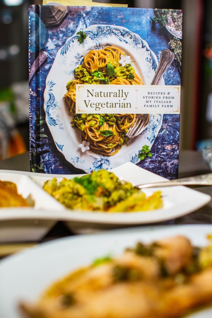 book cover with dishes in foreground